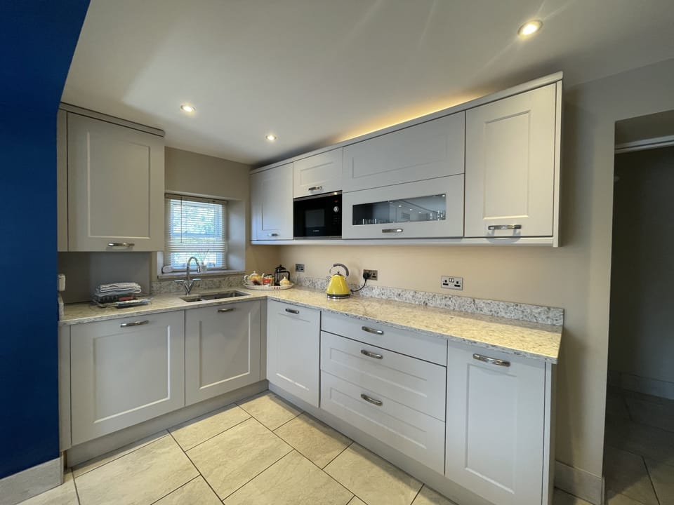 The ground floor has been stylishly tiled throughout with underfloor heating for extra comfort