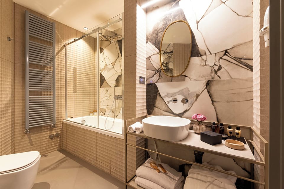 Rainfall showerhead, designer toiletries, hair dryer, bathrobes