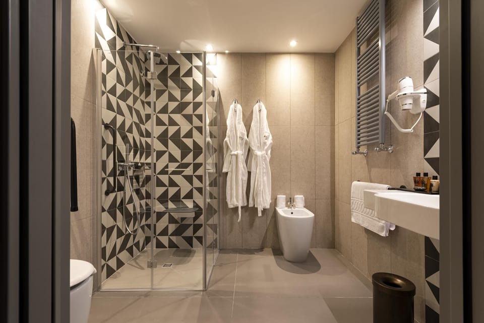 Rainfall showerhead, designer toiletries, hair dryer, bathrobes
