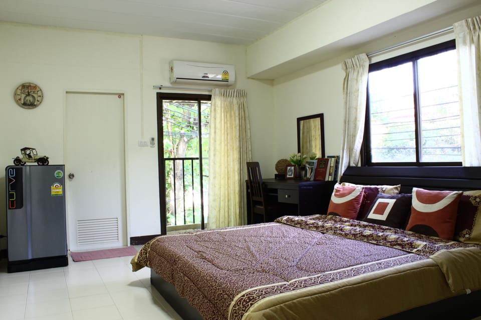 Desk, blackout drapes, iron/ironing board, rollaway beds