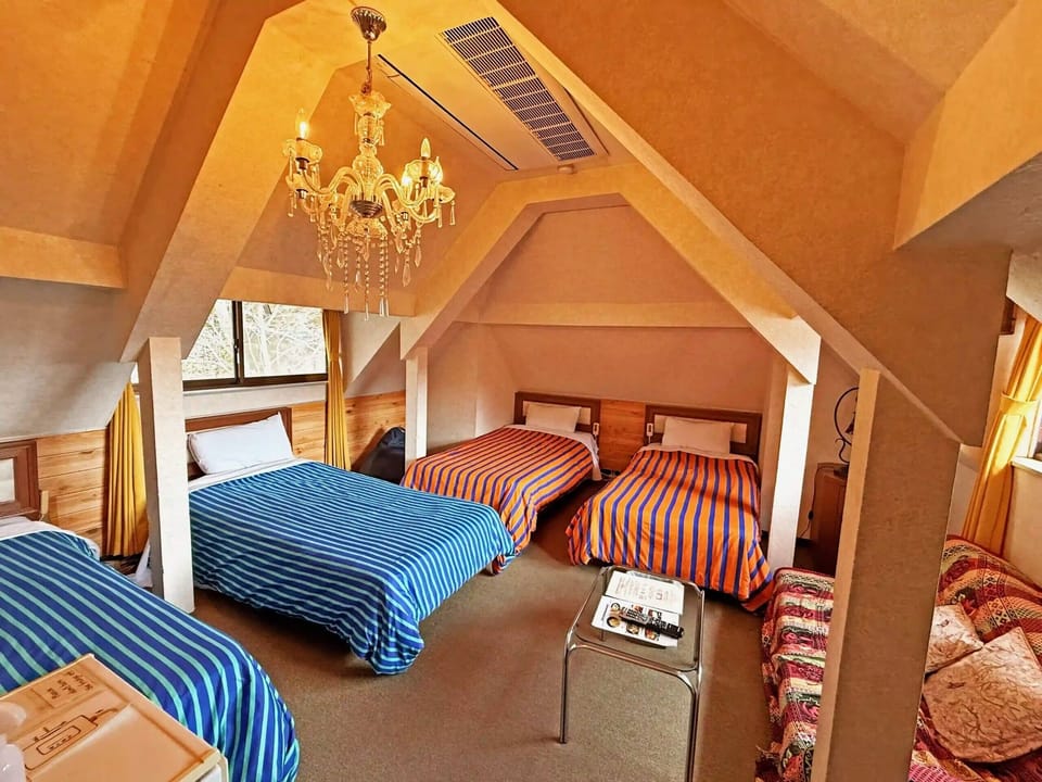 Family Room | In-room safe, desk, blackout drapes, iron/ironing board
