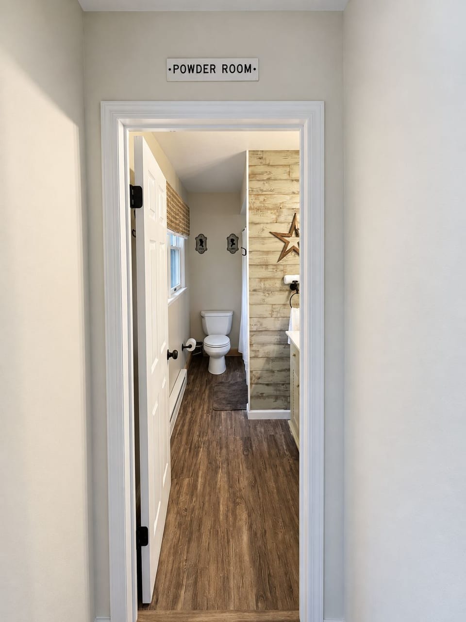 Rustic first-floor full bath with farmhouse charm and clean finishes.