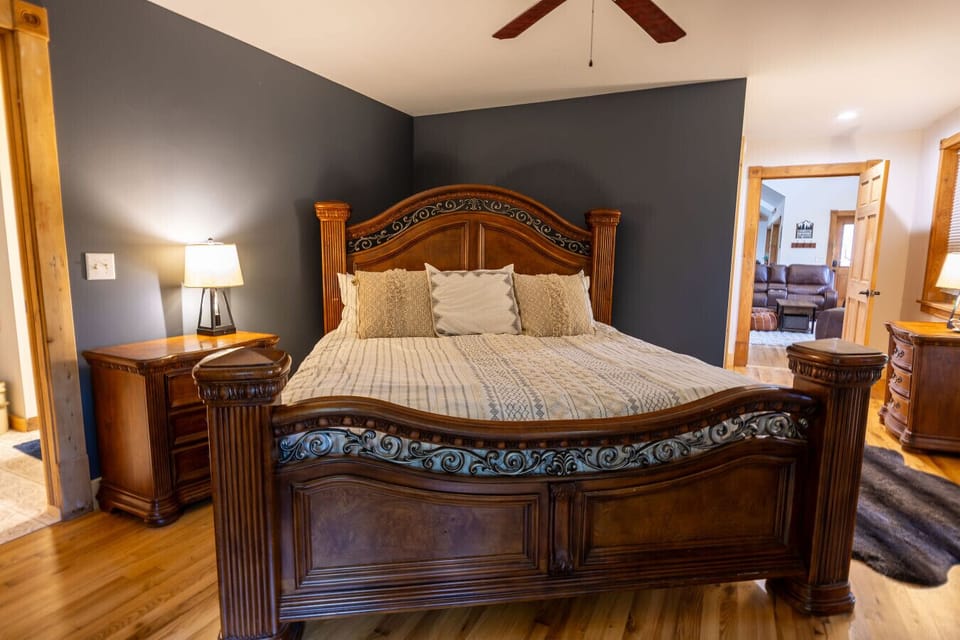 Primary Bedroom: Experience luxury in a king-sized retreat, adorned with plush pillows and natural light!