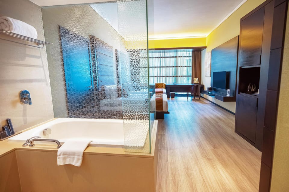 Premium bedding, down comforters, pillowtop beds, minibar