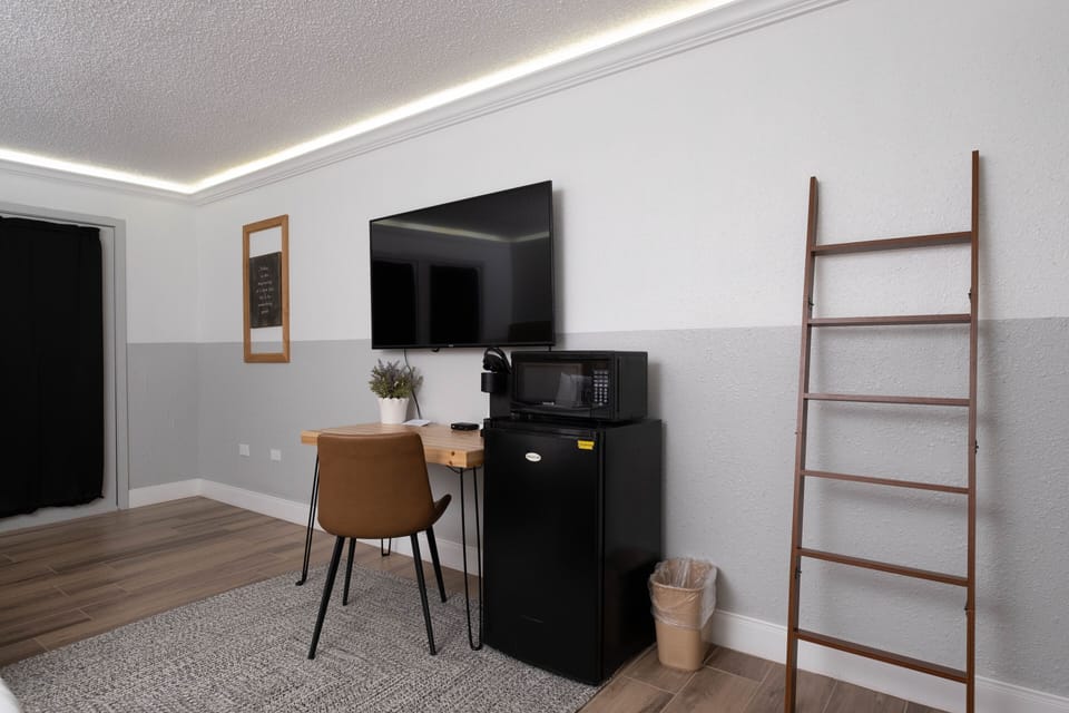 Premium bedding, desk, laptop workspace, blackout drapes