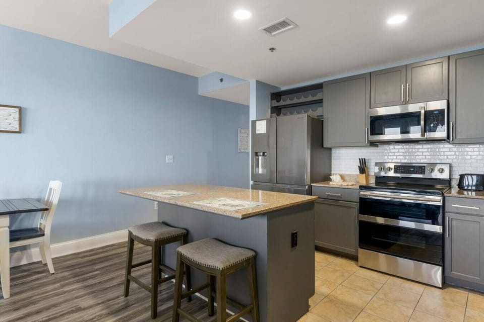 Fully Stocked Kitchen with Lake Views, Island Bar Seating and Drip Coffee Maker