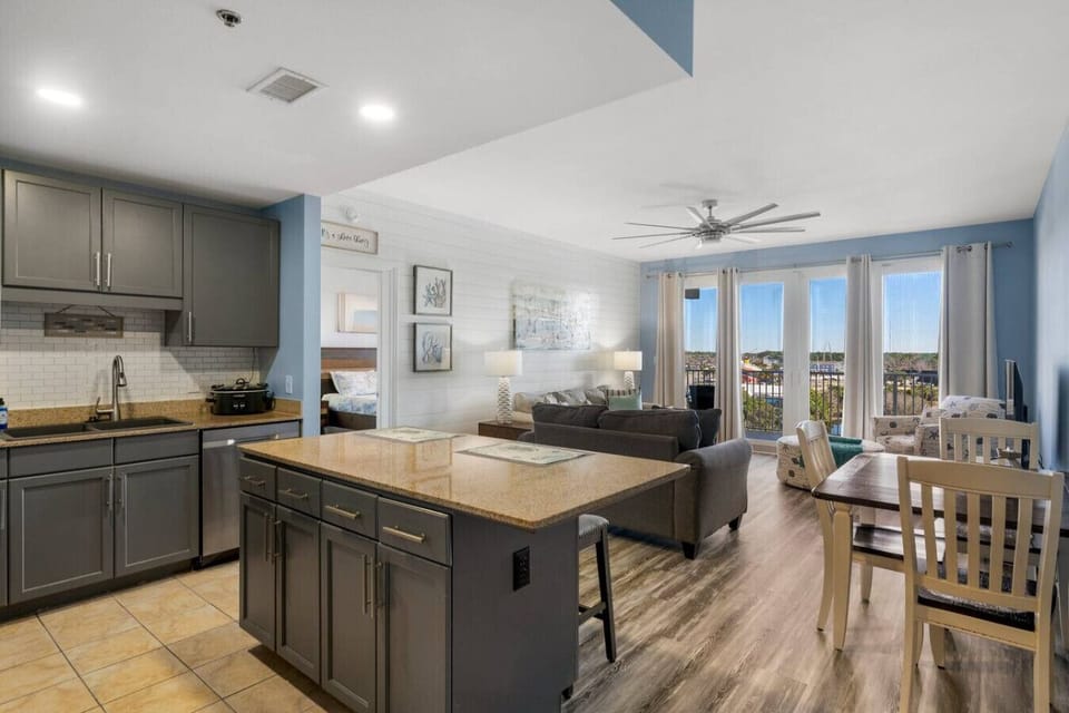 Fully Stocked Kitchen with Lake Views and Island Bar Seating