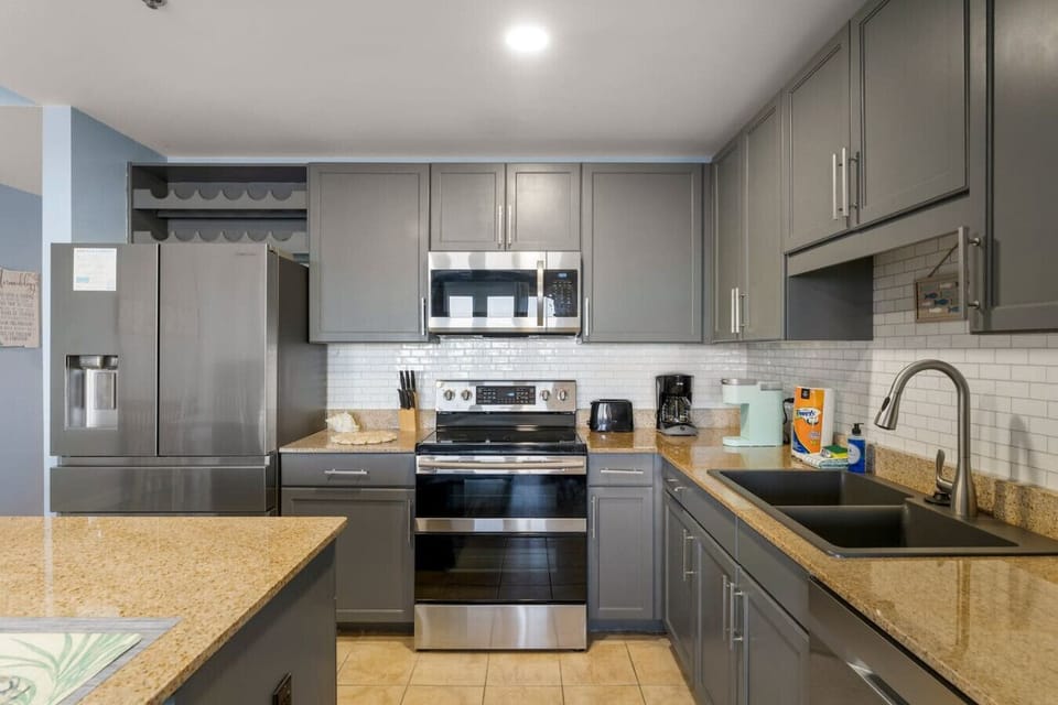 Fully Stocked Kitchen with Lake Views and Island Bar Seating