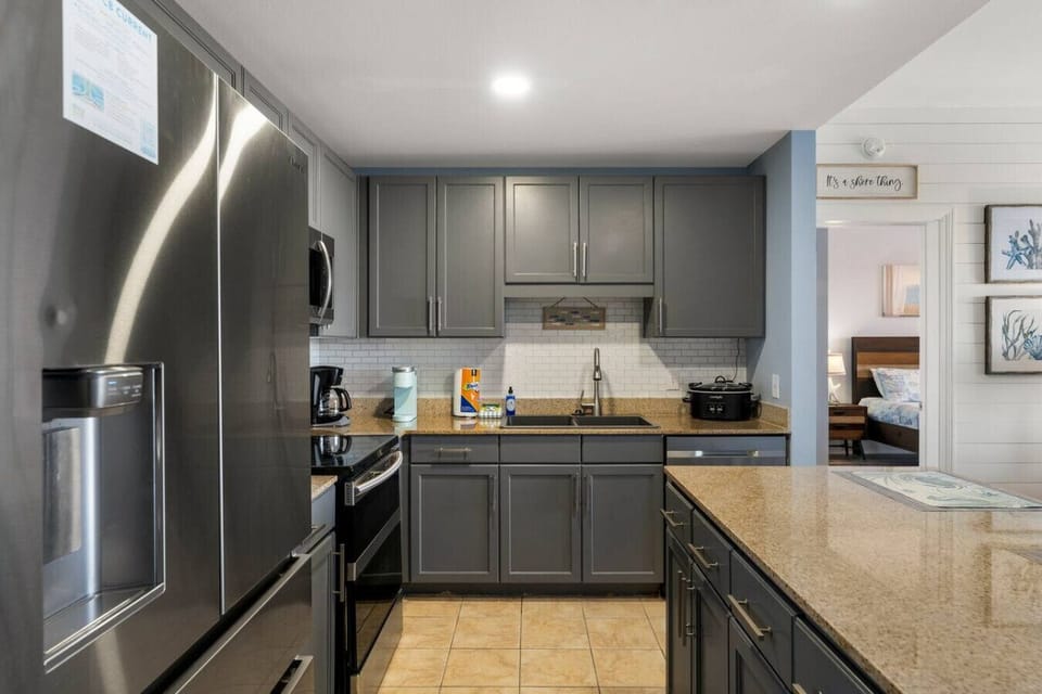 Fully Stocked Kitchen with Lake Views and Island Bar Seating