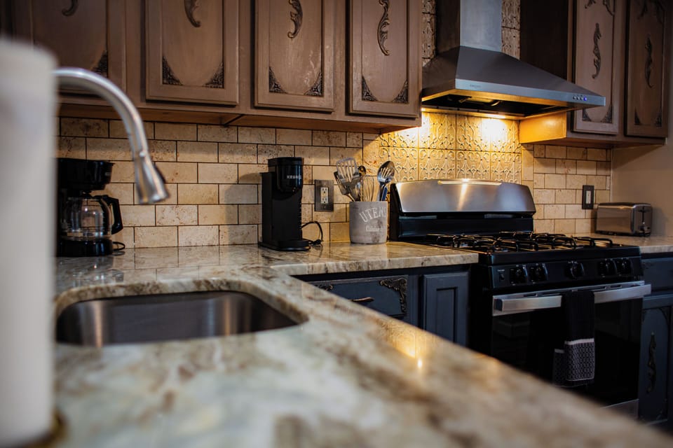 Warm, fully equipped kitchen with gas range and coffee station