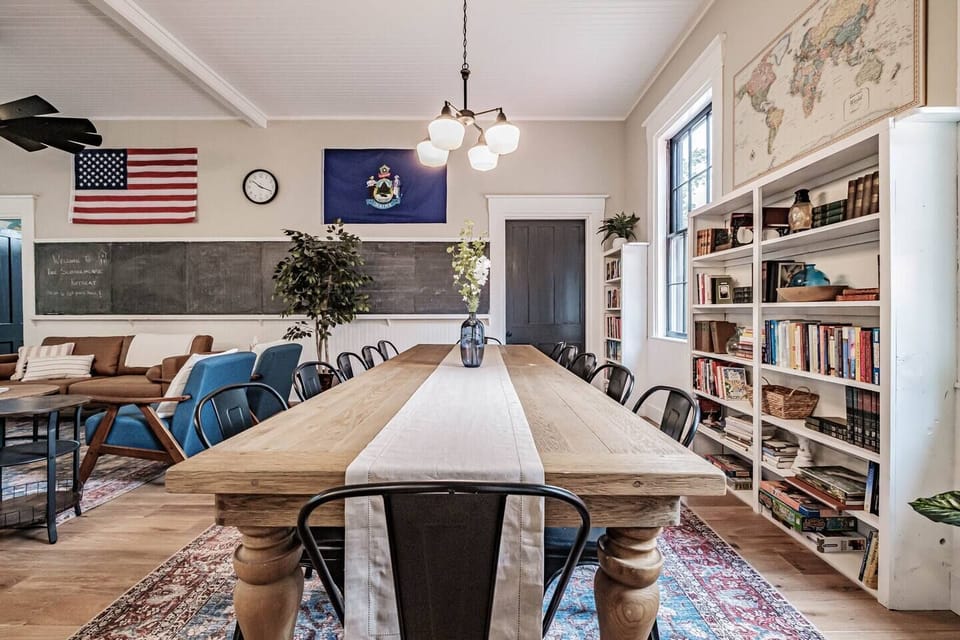 The dining table seats the whole group so that everyone can enjoy a meal or play games together.