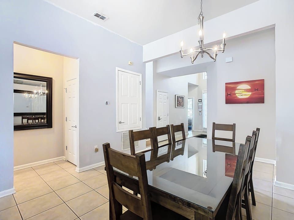 The NEW dining table comfortably seats 8 (booster seat and high chair on site)