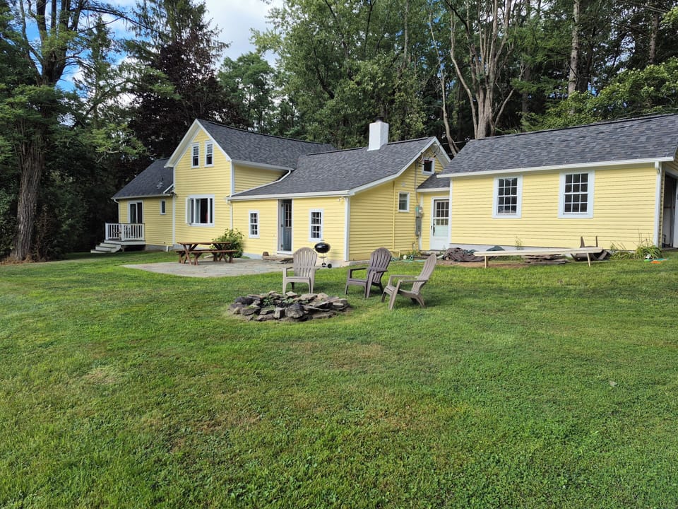 Back of house with patio, fire circle