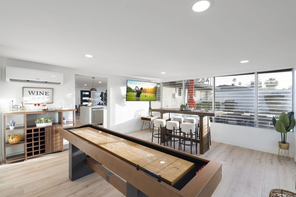 Shuffleboard and seating for 6 in front of the Smart TV!