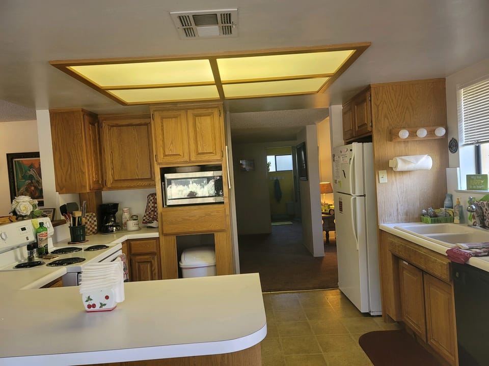 Kitchen with electric stove. Microwave , and dishwasher