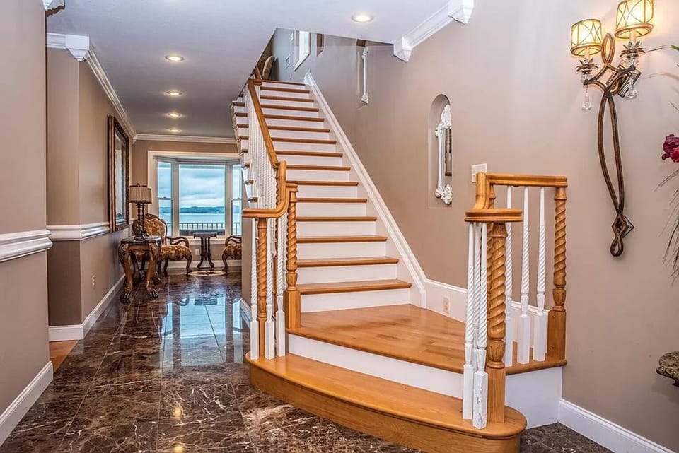 In the front door, laundry room on the left, hallway to 2 bedrooms on the left.