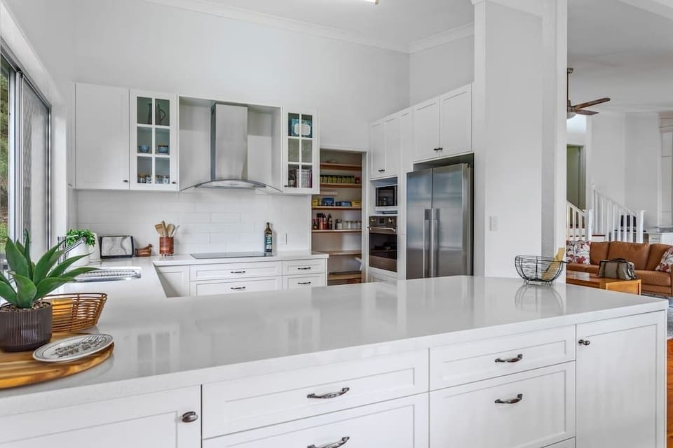 Chef's kitchen leading on to dining room and lounge.