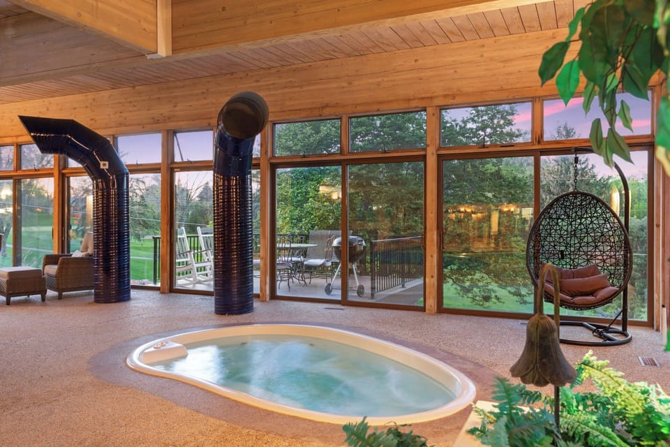 Relaxation awaits in this inviting indoor hot tub, where the bubbling waters and scenic views offer a tranquil escape from the everyday.