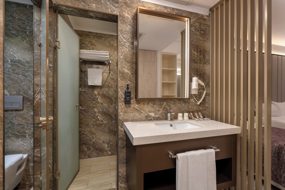 Shower, free toiletries, hair dryer, slippers