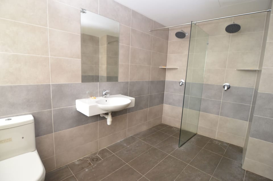 Shower, rainfall showerhead, hair dryer, towels