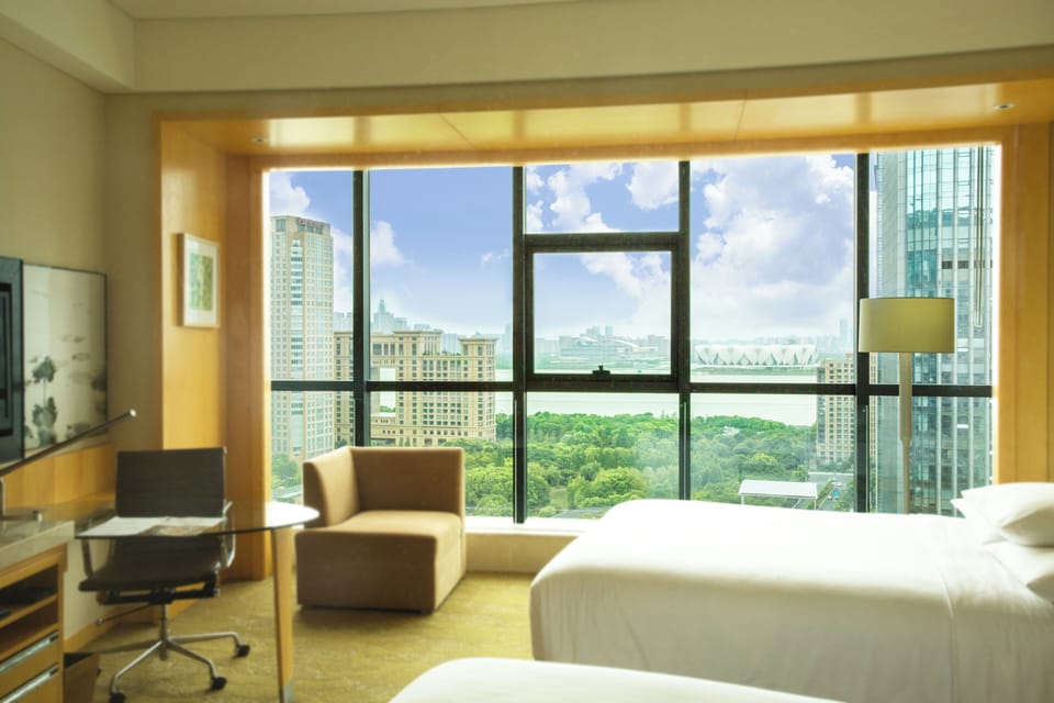 Twin Room, 2 Double Beds, River View | Down comforters, pillowtop beds, minibar, in-room safe