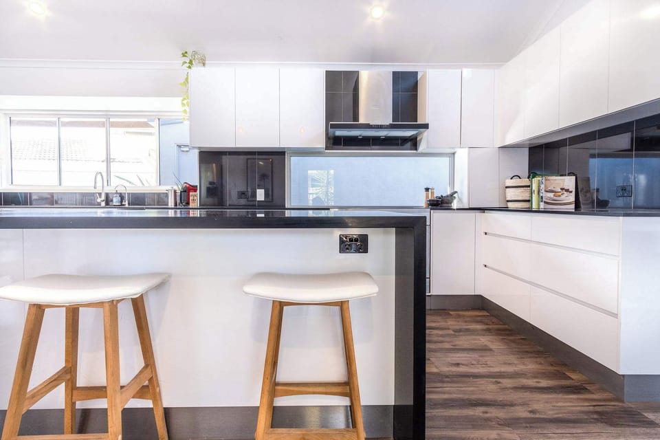 Island seating is available in the kitchen.