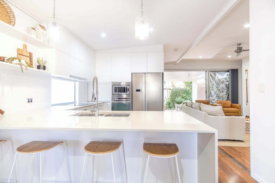 The kitchen features modern appliances and a spacious serving area.