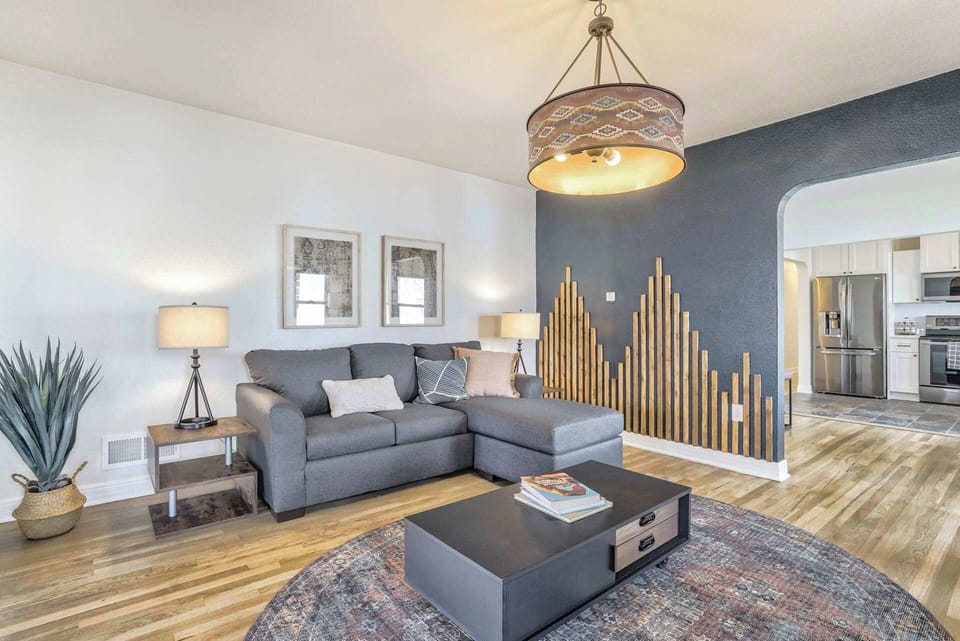 Enjoy a cozy evening in this inviting living area with a comfortable sofa.