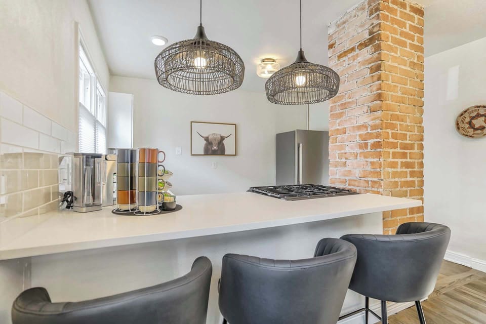 Relax at the stylish kitchen bar, perfect for sipping coffee or enjoying a casual meal.