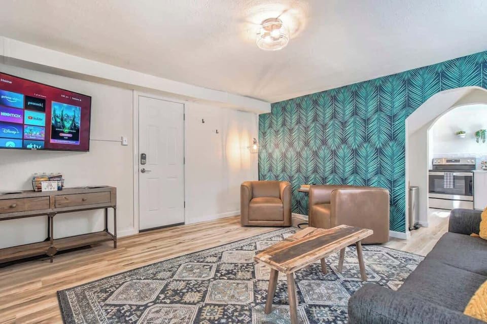Sink Into Our Cozy Sofa and Chairs, Bask in the Warm Glow of Lamps, and Enjoy Entertainment on Our Smart Roku TV. Spacious Comfort, Perfected.