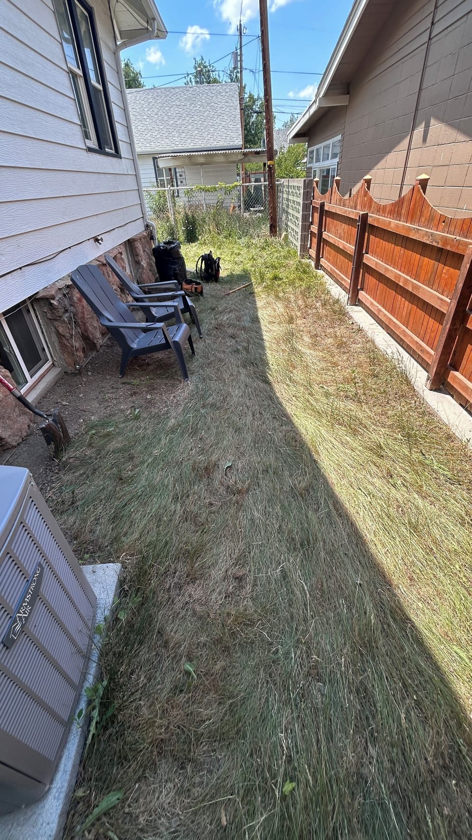 Private Side yard (enclosed on 3 sides). Charcoal BBQ and Outdoor seats provided