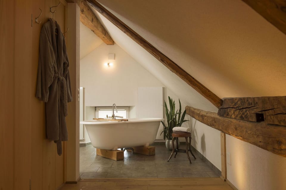Deluxe Double Room | Bathroom | Deep soaking tub, hair dryer, bathrobes, towels