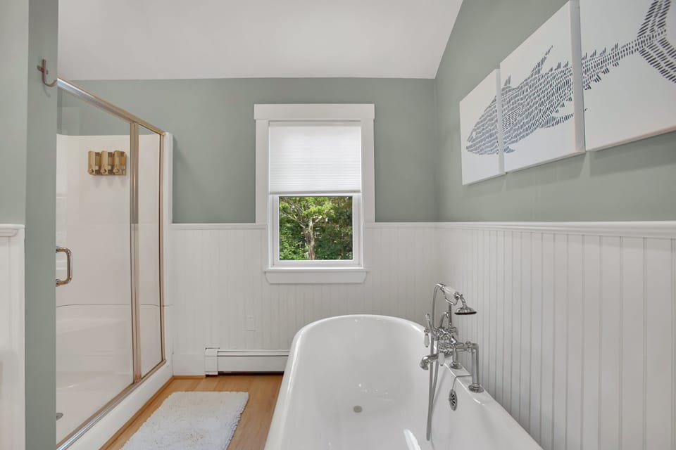 Ensuite bathroom off master bedroom with shower and tub