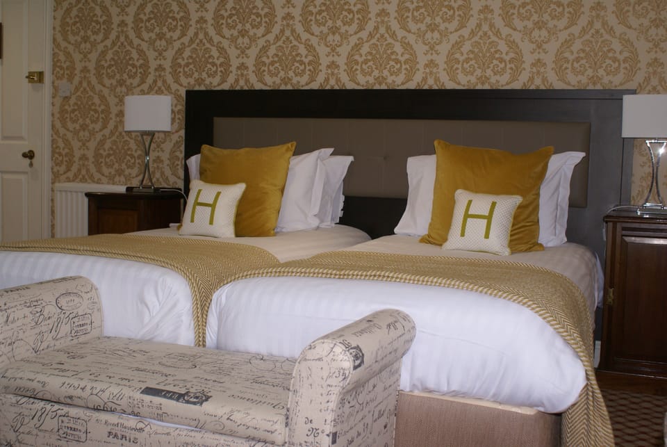 Desk, laptop workspace, blackout drapes, iron/ironing board