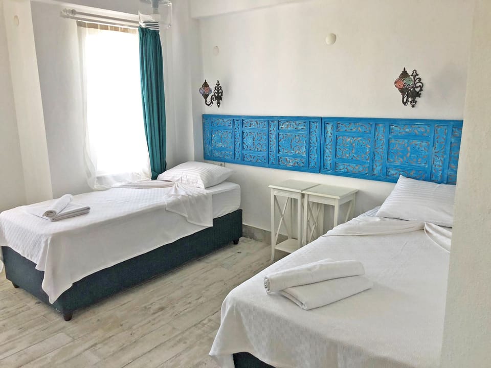 Deluxe Quadruple Room, Garden View | Free WiFi
