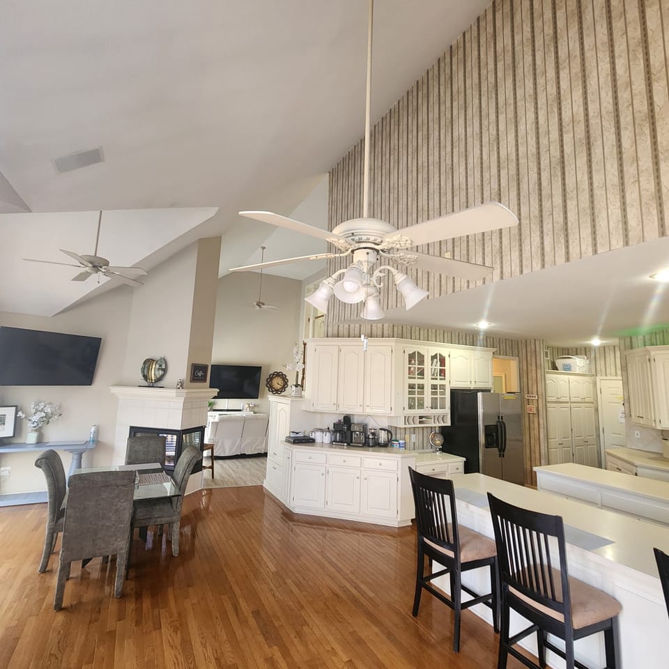 Kitchen has another Table plus the High chairs over the counter. 58" TV 1stFloor