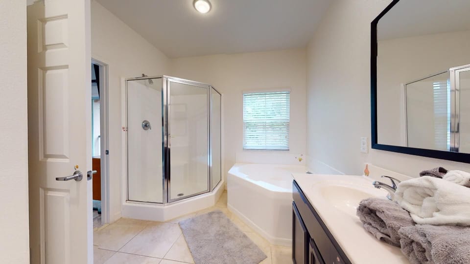 Master bath, sep tub and shower. 