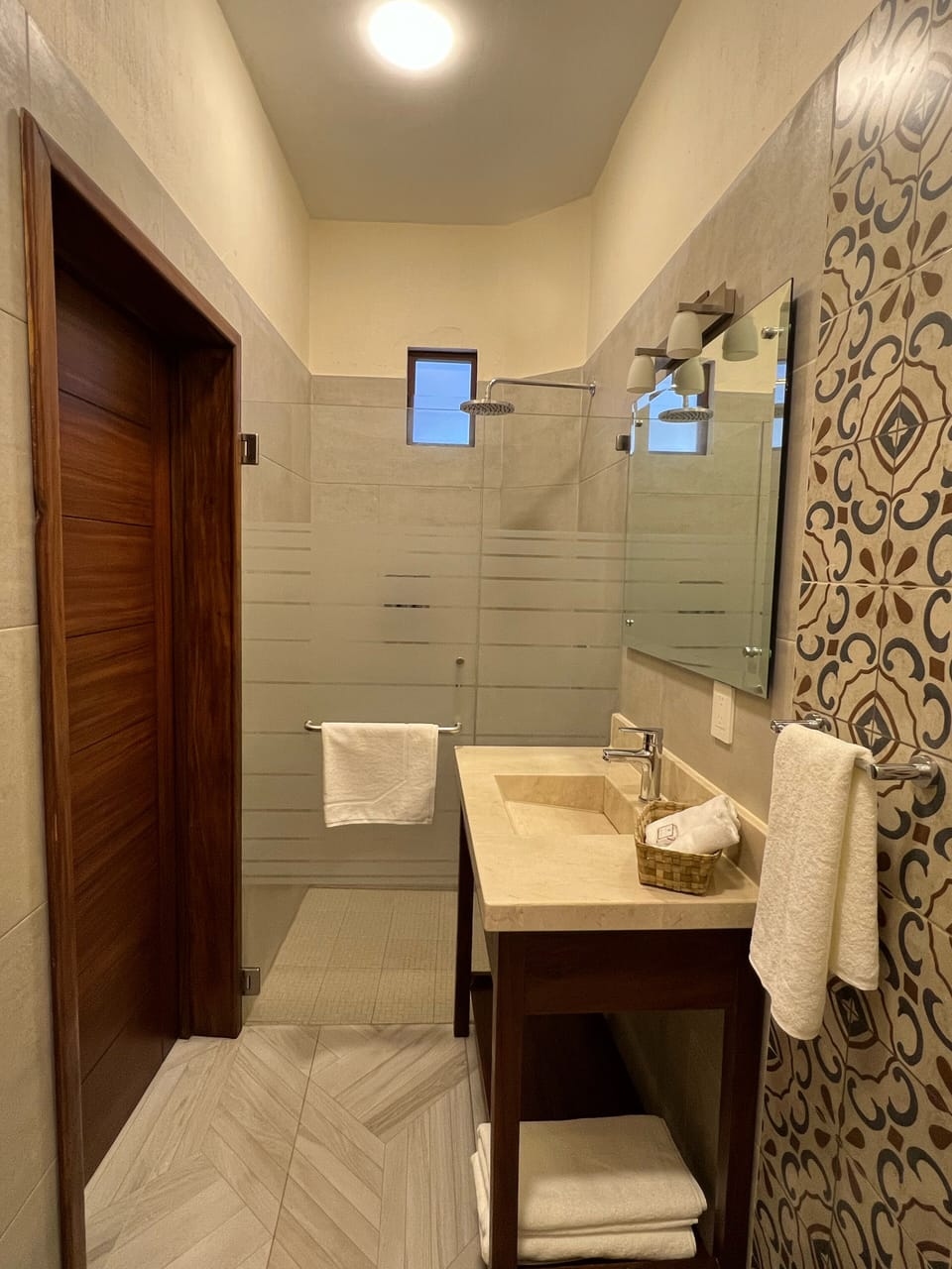 Shower, rainfall showerhead, towels, soap