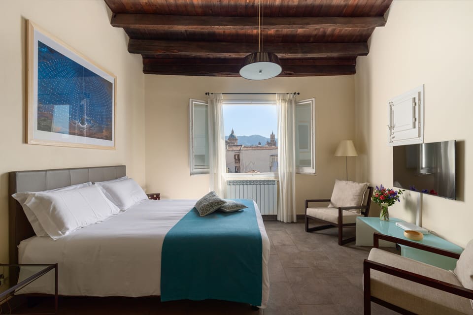 Suite, Balcony | Minibar, individually decorated, individually furnished, desk