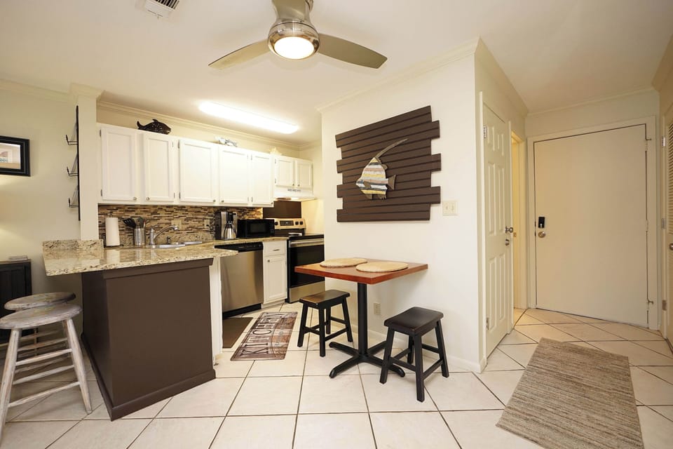 Step into your fully equipped kitchen with granite counters, stainless appliances, and breakfast bar—perfect for cooking memorable meals together.
