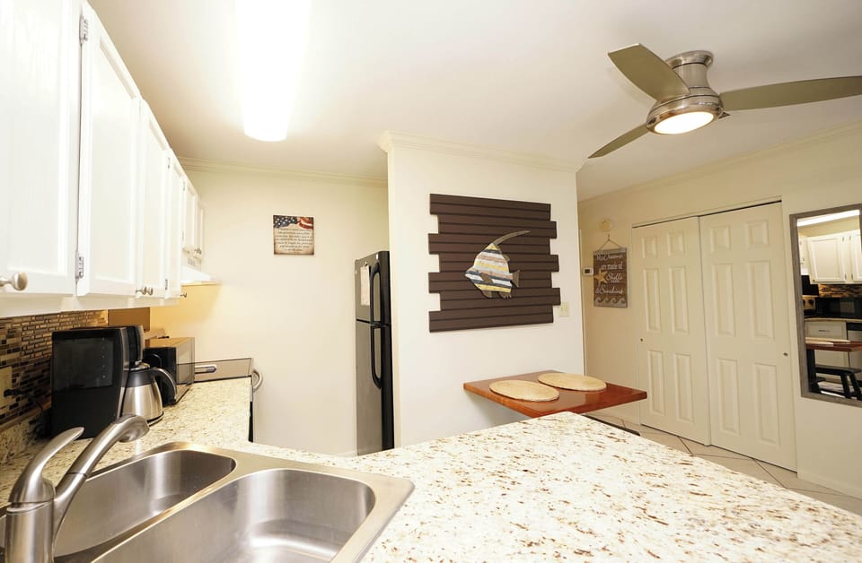 Your fully equipped kitchen features granite countertops, modern appliances, and plenty of space for preparing meals during your stay.
