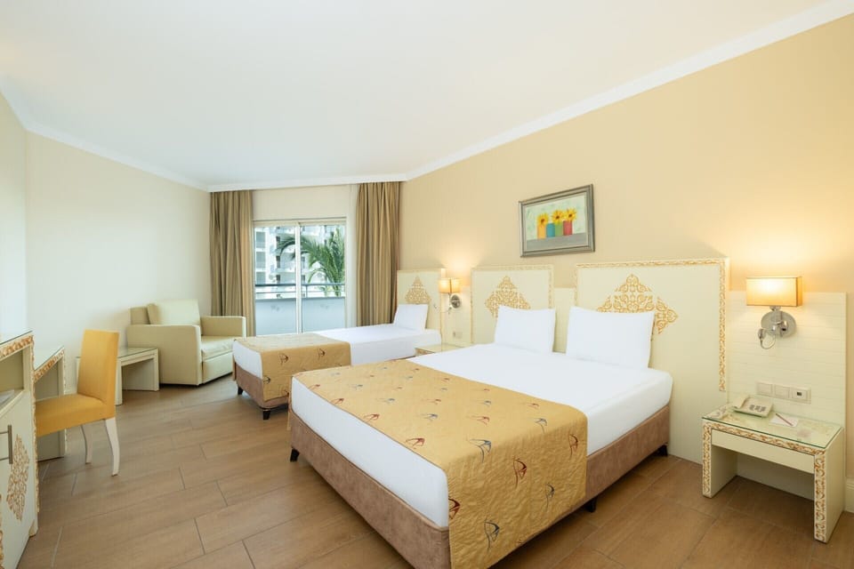 Standard Room, Partial Sea View | Premium bedding, free minibar, in-room safe, desk