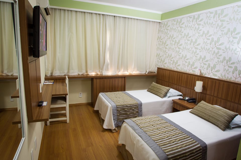 Comfort Room | Minibar, laptop workspace, blackout drapes, free WiFi