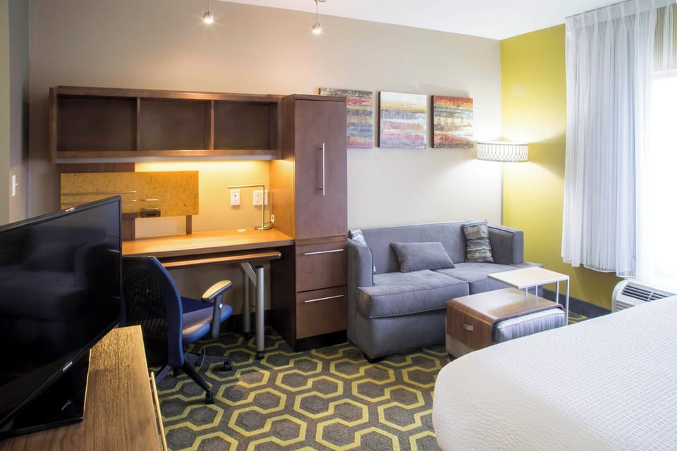Studio, 1 King Bed | Living area | TV