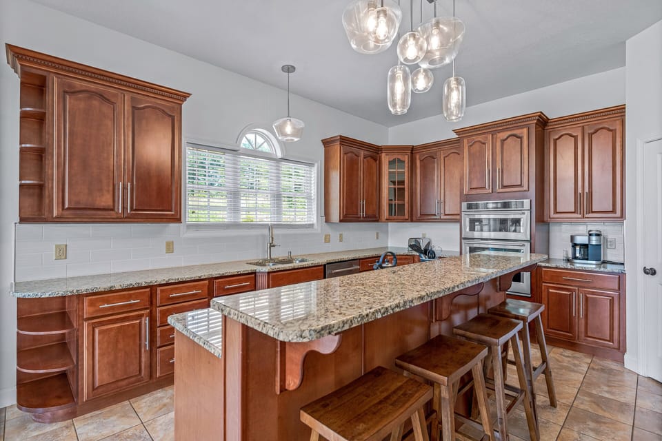 Enjoy A Quick Lunch At The Breakfast Bar In This Chef's Kitchen.