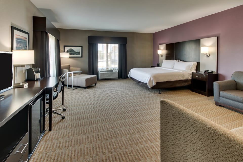 Desk, blackout drapes, iron/ironing board, free cribs/infant beds