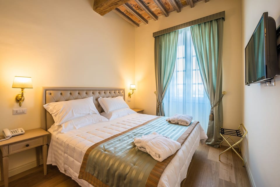 Premium bedding, down comforters, pillowtop beds, minibar