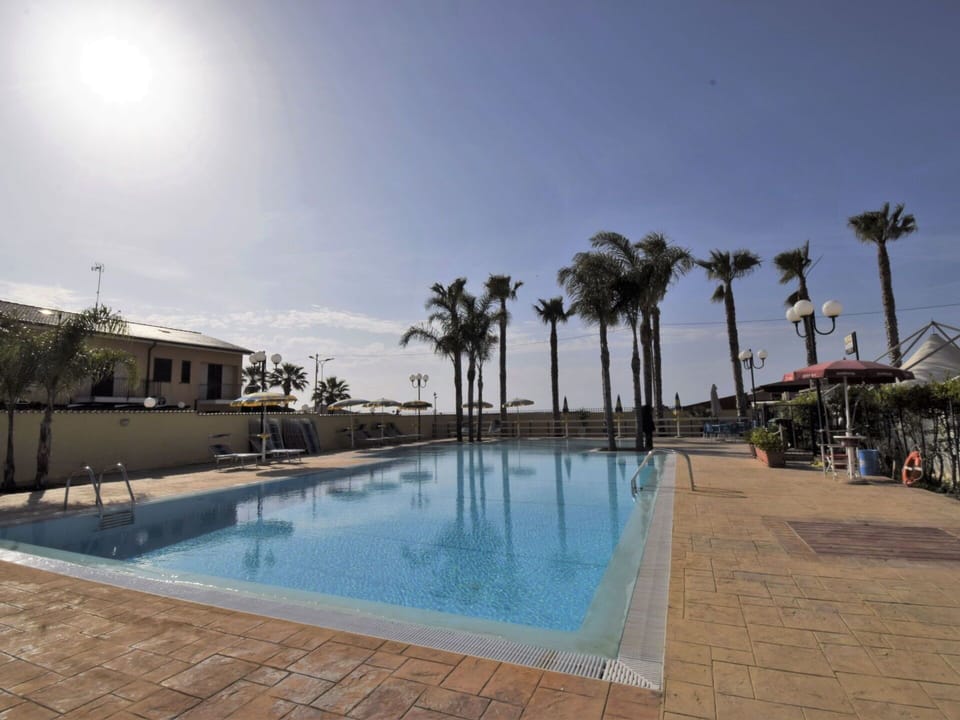 Swimming Pool, Resort, Property, Vacation, Palm Tree, Town, Sky, Leisure, Tree, Real Estate