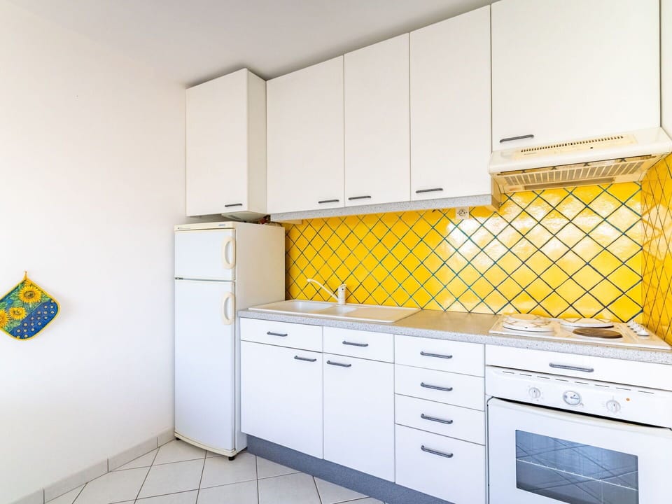 Cabinetry, Furniture, Countertop, Building, Drawer, Kitchen, Interior Design, Flooring, Floor, Tap