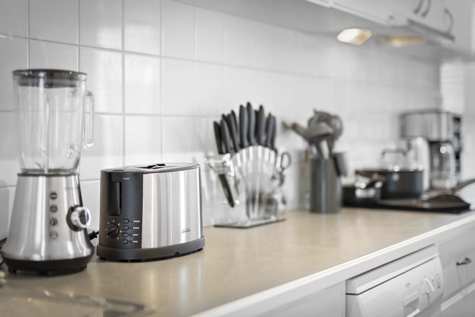 Blender, toaster, knives, cooking utensils.